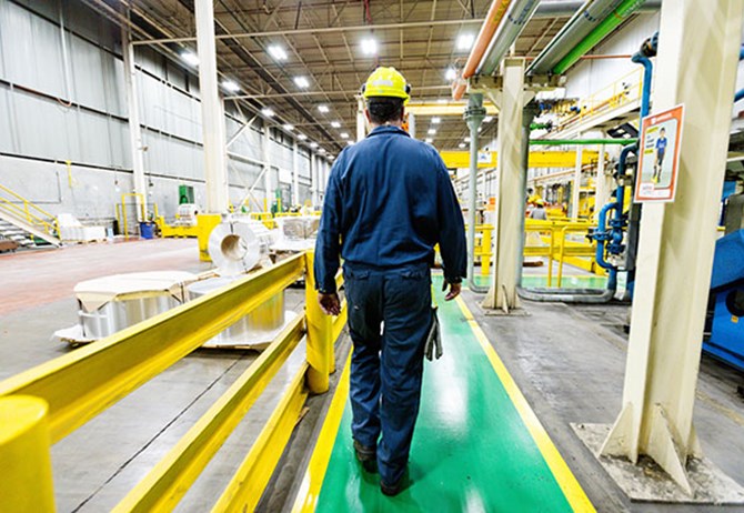 Employee walking safely using the pedestrian safety.
