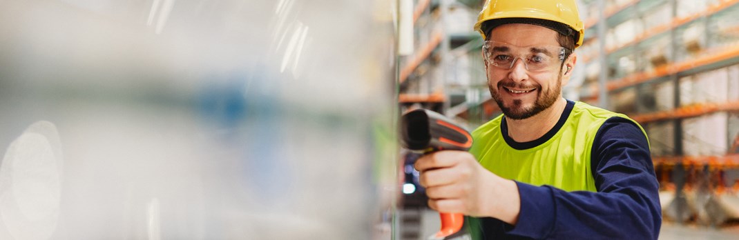 Employee scanning aluminium products.