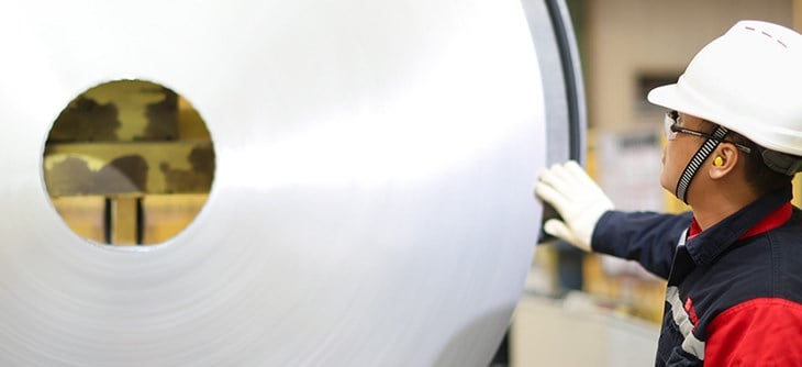 Employee touching an aluminium coil.