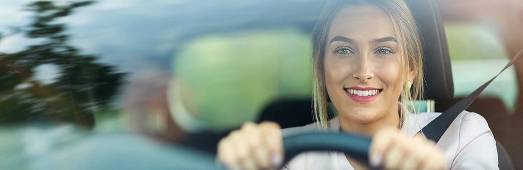 Woman driving a car.