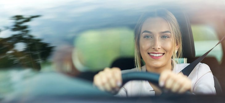 Woman driving a car.