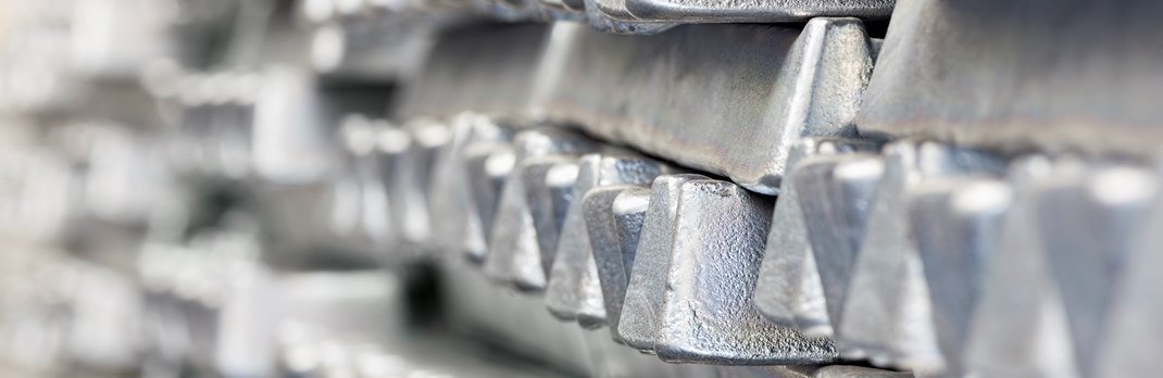 Close up of stacked aluminium ingots.