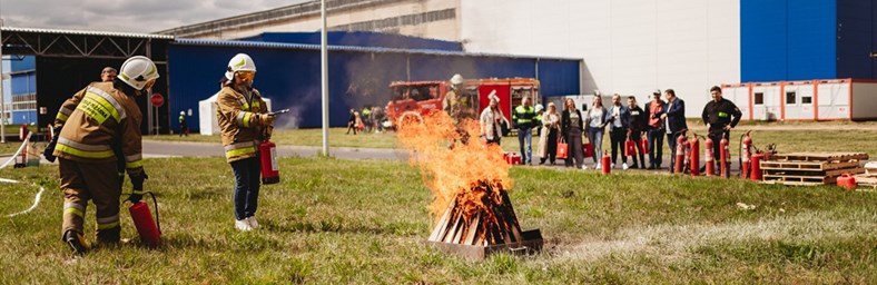 Employees learning fire safety.